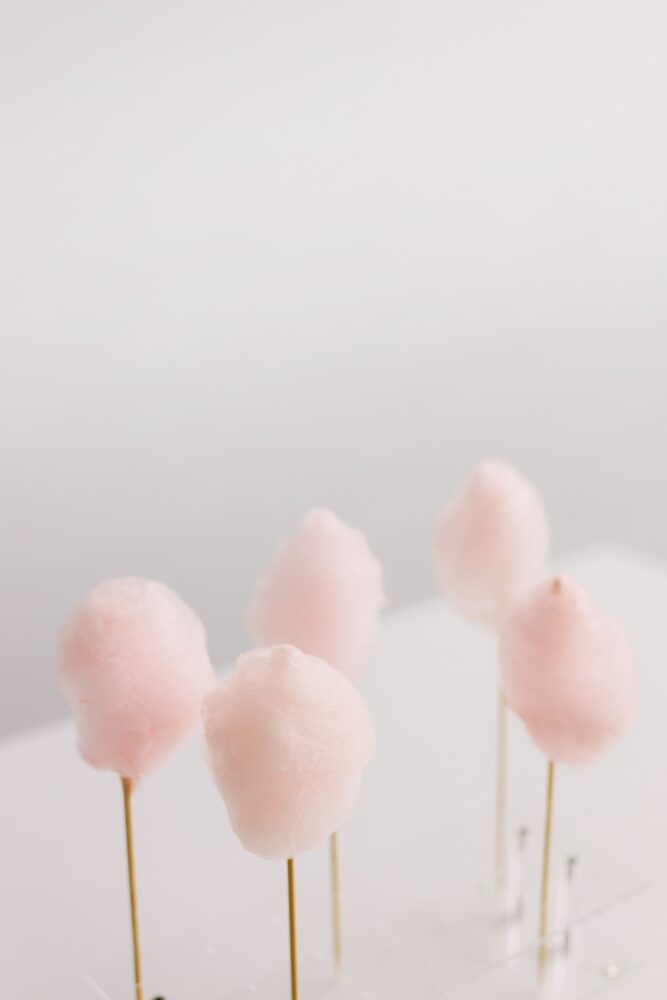 Pink and white cotton candy on sticks