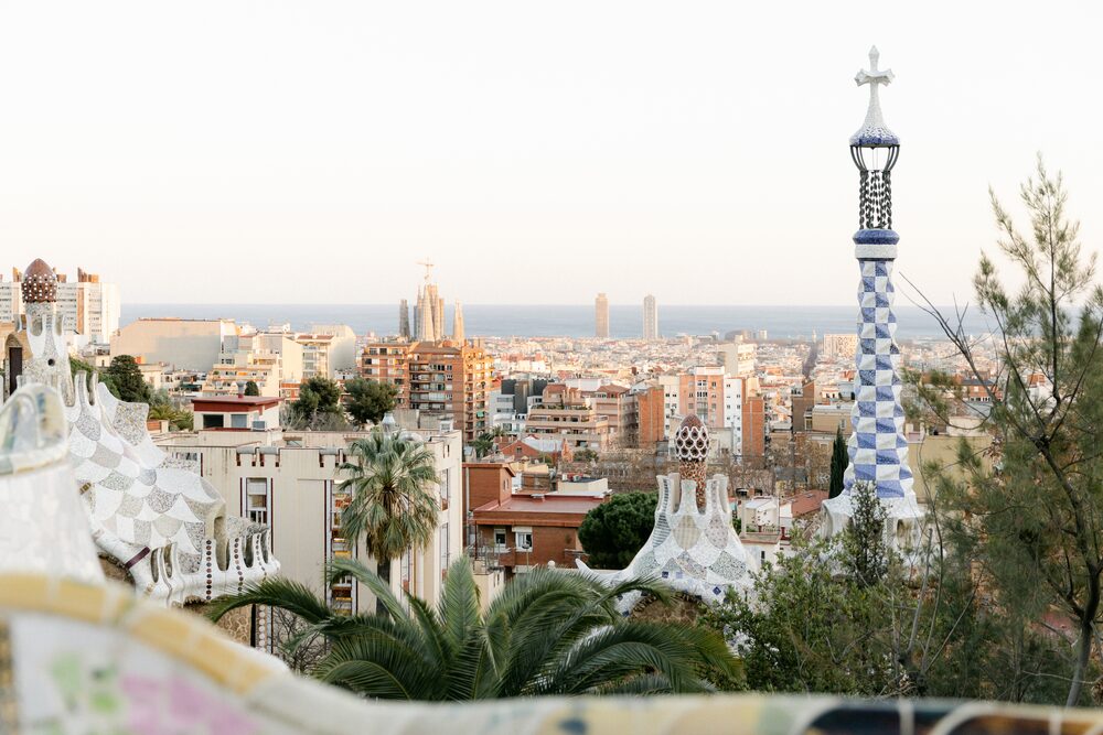 City skyline seen from a park with a mosaic tower