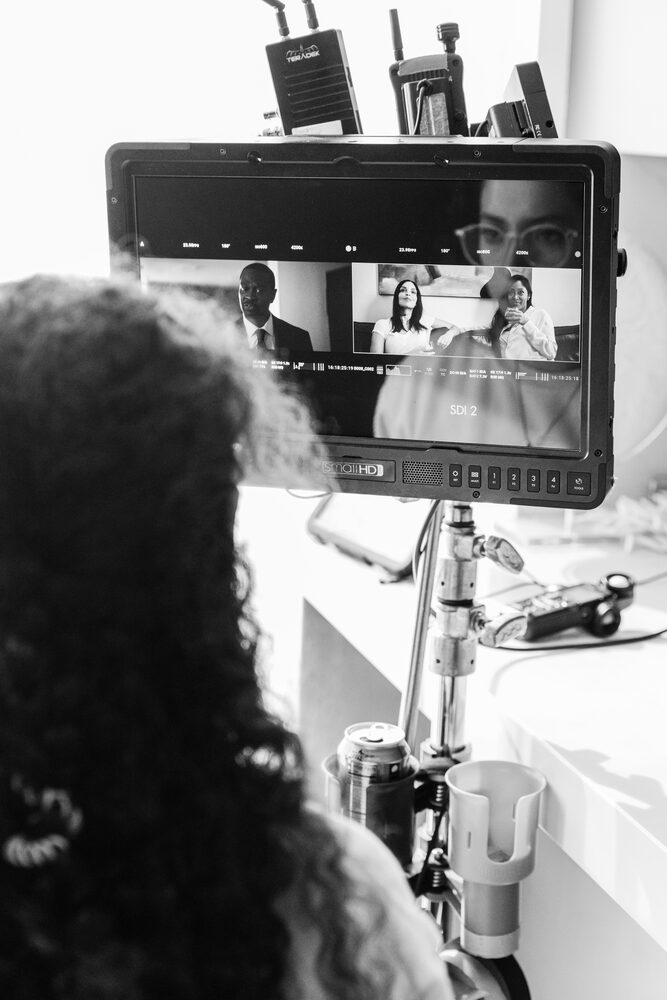 Black and white view of a monitor showing the scene being filmed