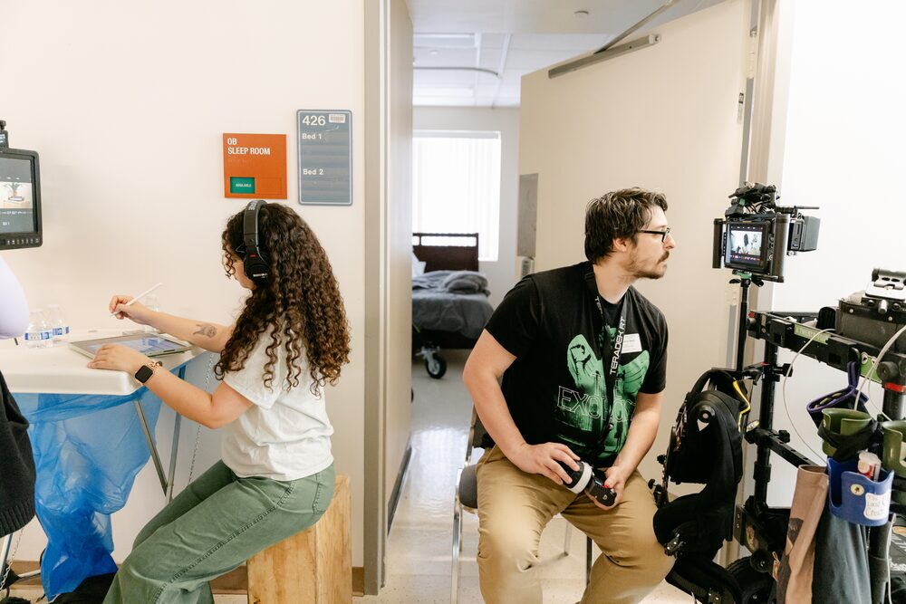 Crew setting up a shot in an office hallway